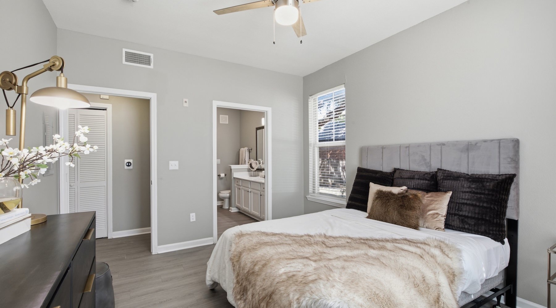 a bedroom with a bed and a dresser