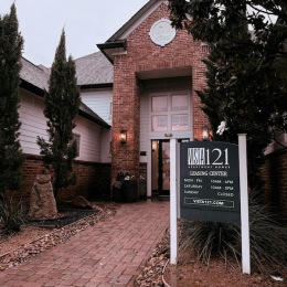 a leasing office with a sign