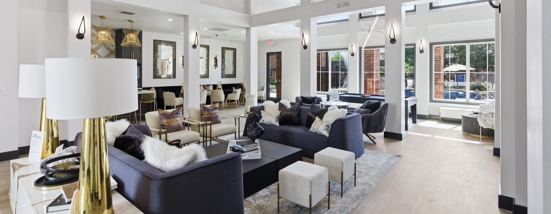 a clubroom with couches, tables and chairs