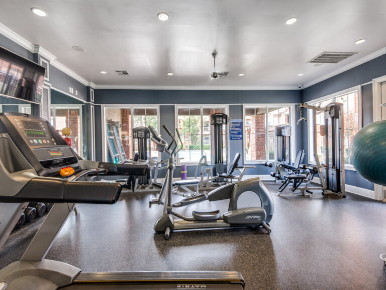 Fitness Center with large windows, cardio equipment 