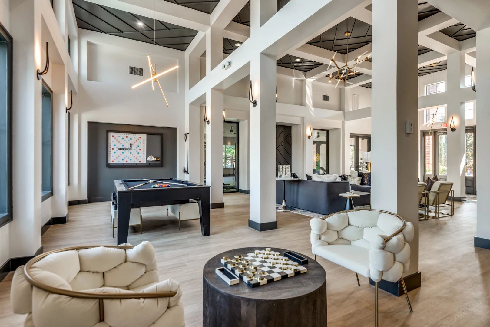 Clubhouse with games, high ceilings and modern seating